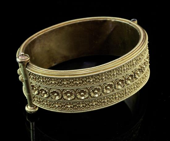 A Victorian gold hinged bangle,